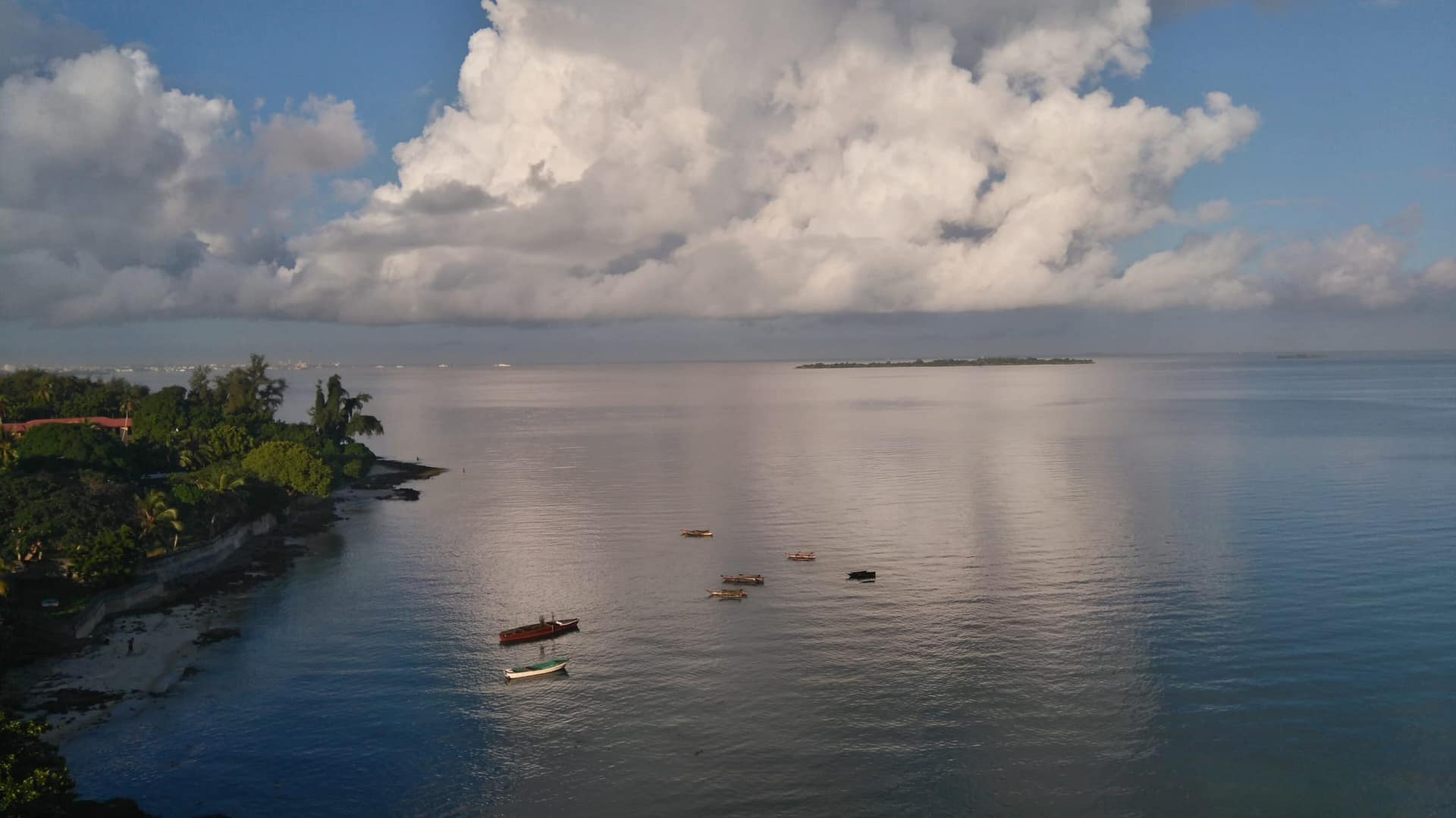 Small fishing boats at sea off Bububu, Zanzibar